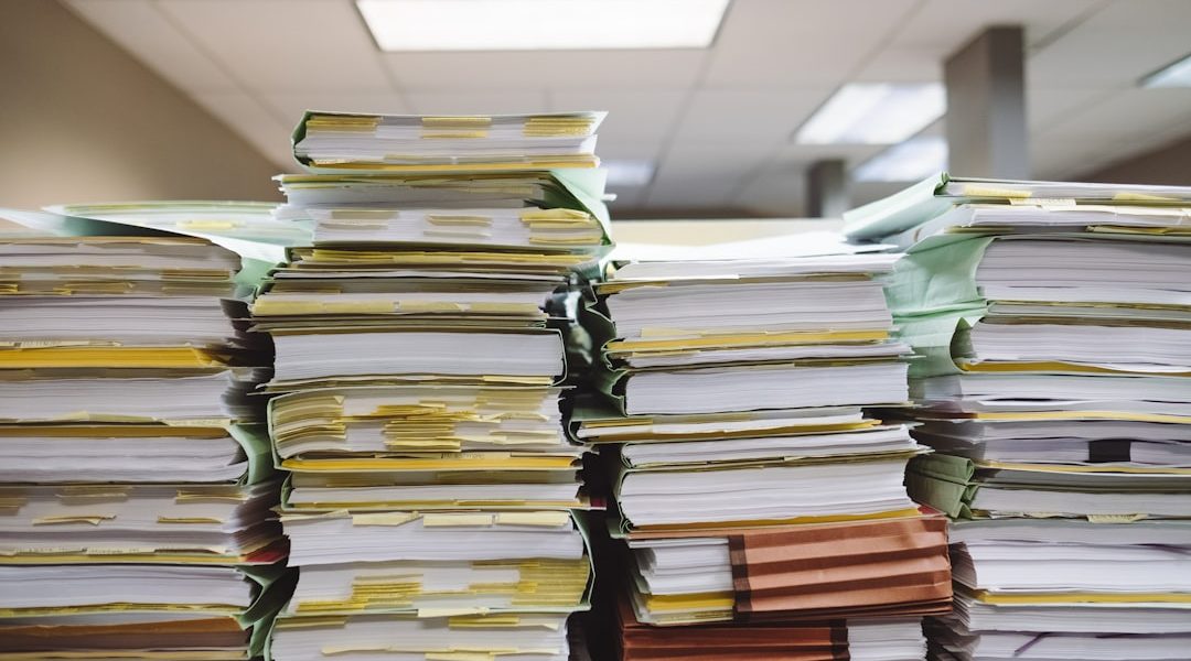 Stack of organized file folders on a desk
