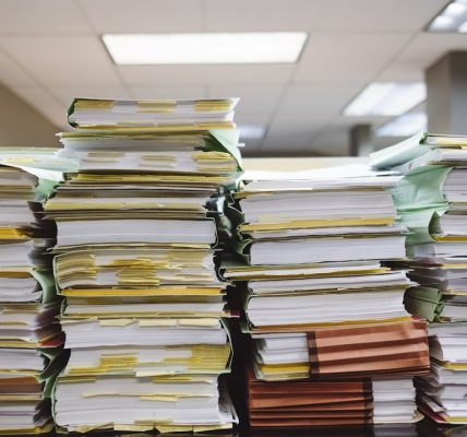 Stack of organized file folders on a desk
