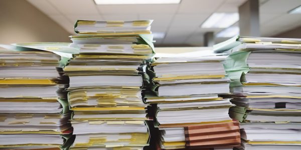 Stack of organized file folders on a desk