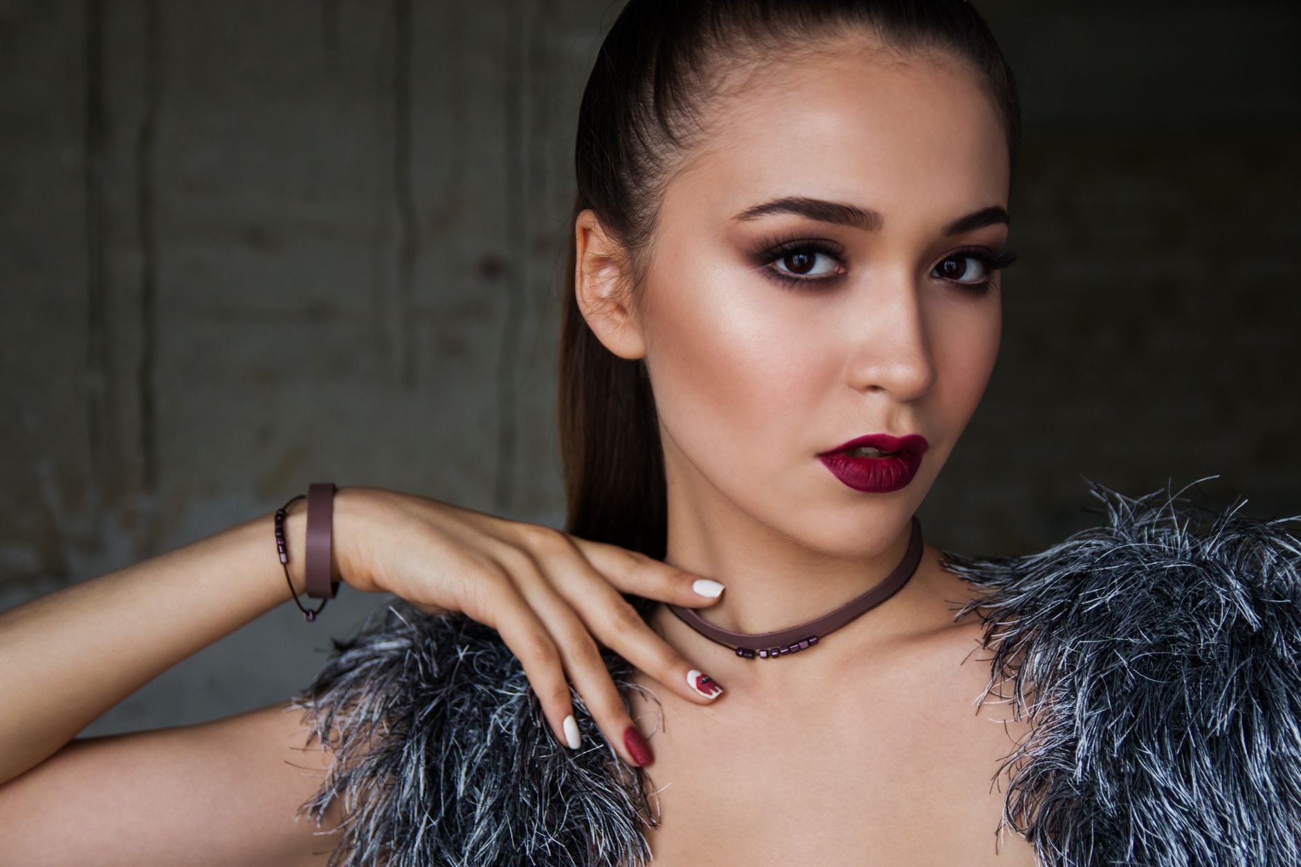 Close-up portrait of an elegant woman with bold makeup and fashionable attire, exuding confidence. — Medical strategies for b